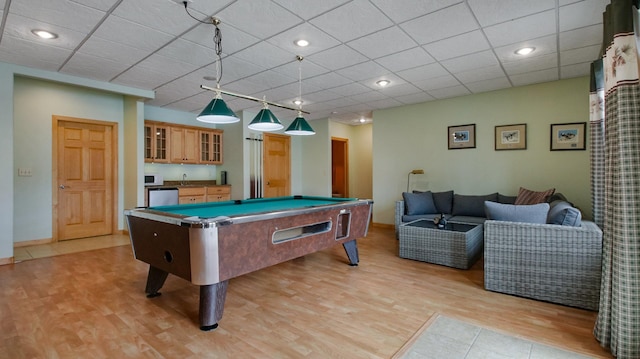 game room with light wood-style floors, a paneled ceiling, pool table, and recessed lighting