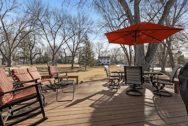 deck featuring outdoor dining area