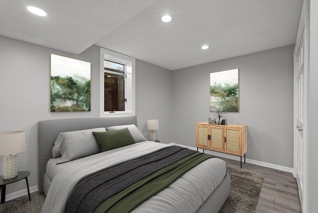 bedroom featuring recessed lighting, baseboards, and wood finished floors