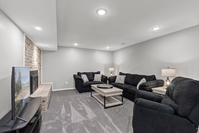 living room featuring visible vents, baseboards, carpet floors, recessed lighting, and a fireplace