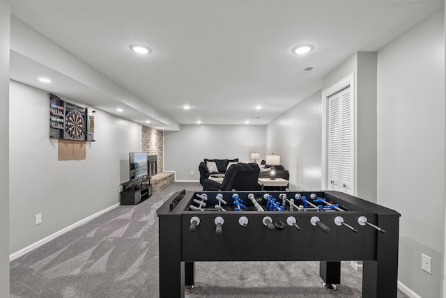 game room featuring a fireplace, recessed lighting, carpet, and baseboards