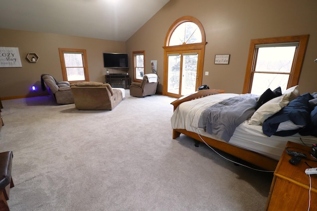 bedroom featuring high vaulted ceiling, access to outside, and carpet flooring