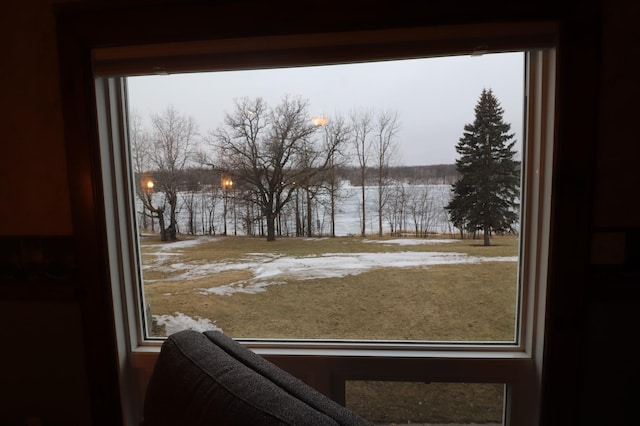 doorway to outside with a water view