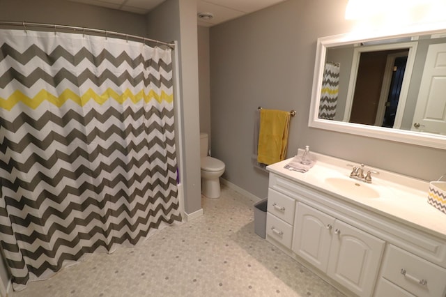 full bath with a shower with shower curtain, toilet, vanity, baseboards, and tile patterned floors