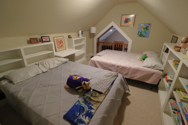 bedroom with vaulted ceiling and carpet