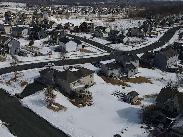 snowy aerial view featuring a residential view