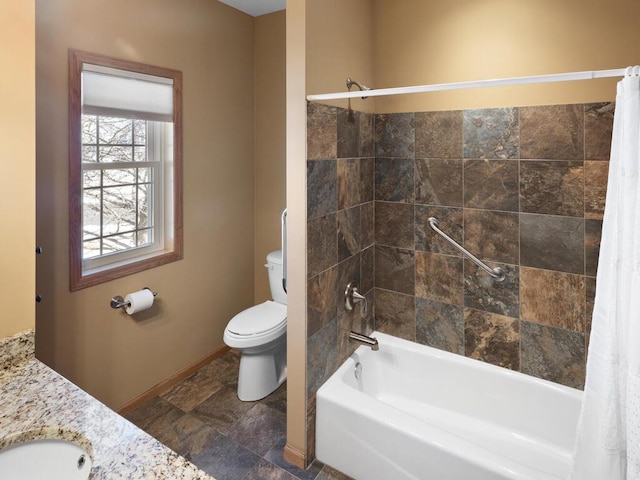 full bath with toilet, shower / tub combo, baseboards, and a sink