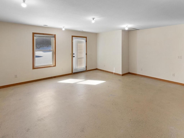 empty room featuring baseboards