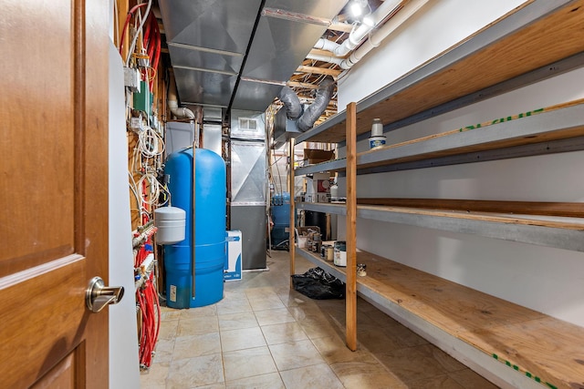 utility room with heating unit