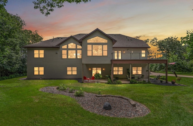 3126 137th Ave NE, Ham Lake, MN 55304 - back of property with a patio area, a yard, and a balcony