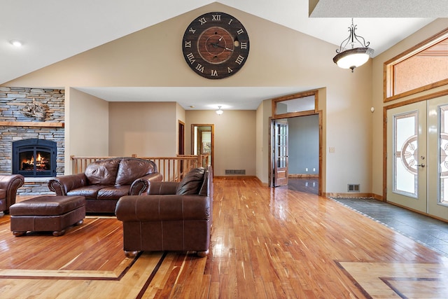 3126 137th Ave NE, Ham Lake, MN 55304 - living room with french doors, high vaulted ceiling, hardwood / wood-style floors, and a fireplace