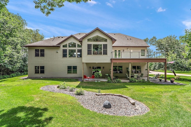 3126 137th Ave NE, Ham Lake, MN 55304 - rear view of property featuring a patio and a yard