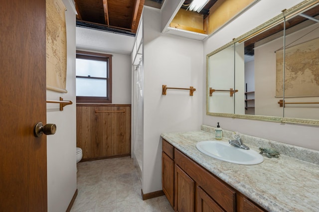 bathroom with toilet and vanity