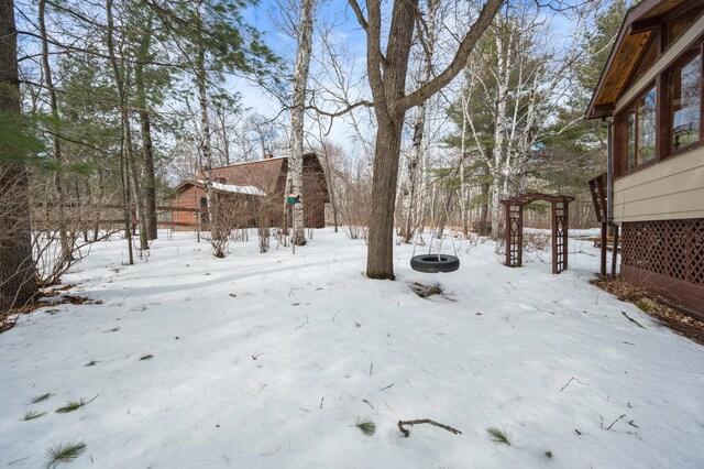 view of yard covered in snow