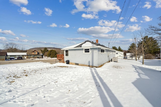 view of snow covered house