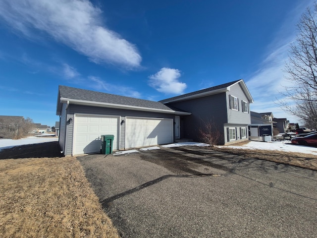 view of side of property featuring a detached garage