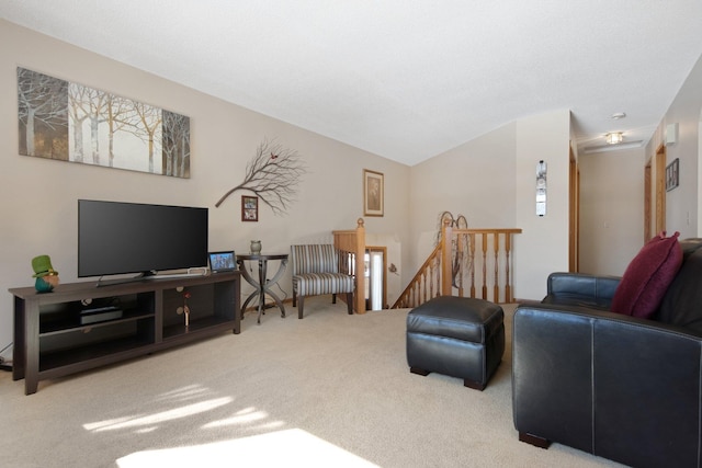 living area with lofted ceiling and carpet flooring