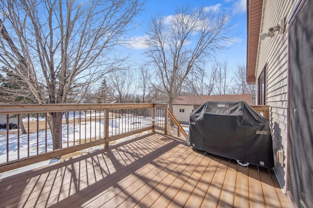 wooden deck with area for grilling