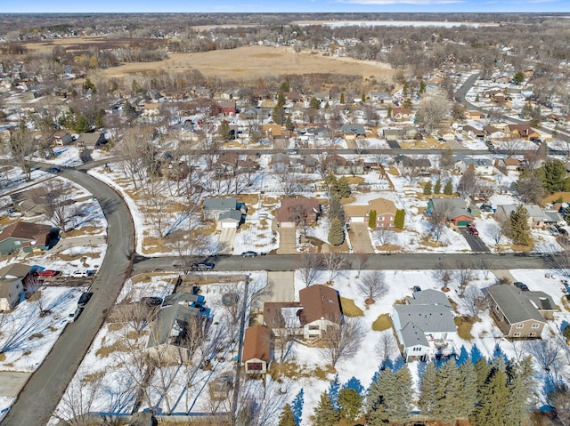 snowy aerial view featuring a residential view