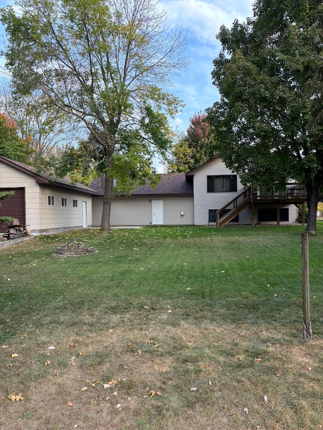 view of yard featuring stairway and a deck