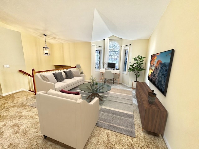 living room with light colored carpet, baseboards, and vaulted ceiling