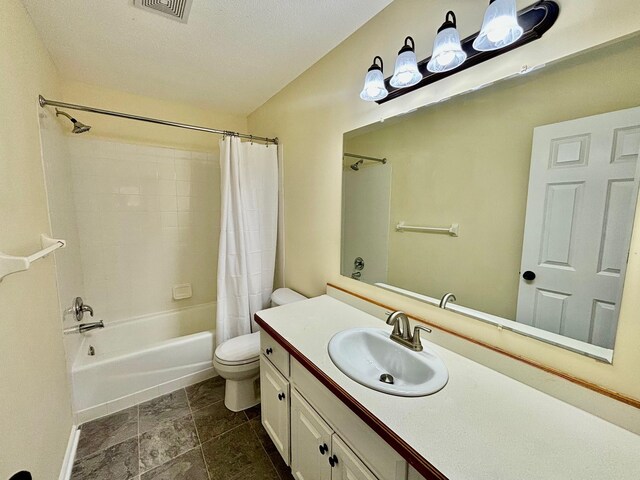 full bath featuring visible vents, toilet, vanity, and shower / bath combo