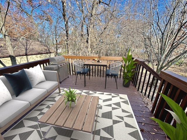 wooden deck featuring area for grilling and an outdoor hangout area