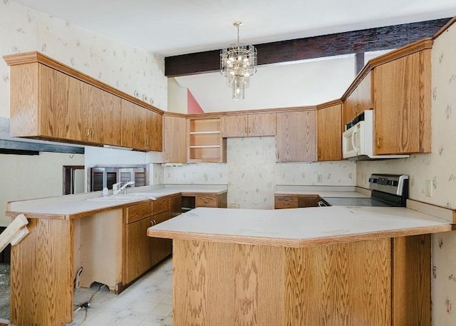 kitchen with a peninsula, white microwave, light countertops, and stainless steel range with electric stovetop