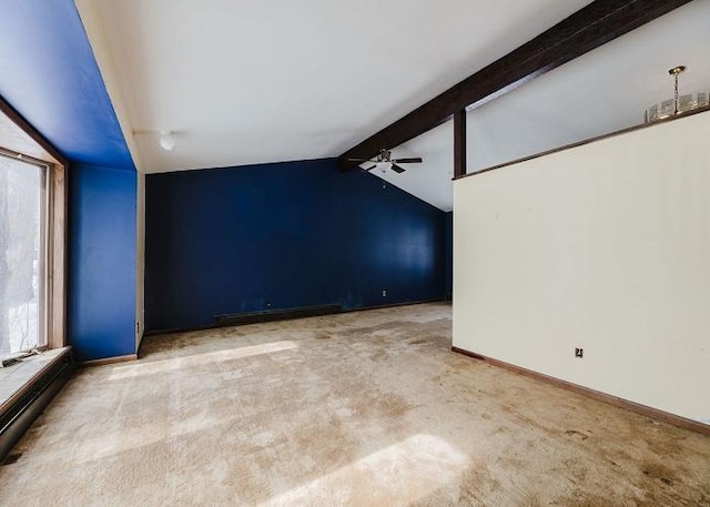 carpeted empty room with vaulted ceiling with beams, a baseboard heating unit, ceiling fan, and baseboards