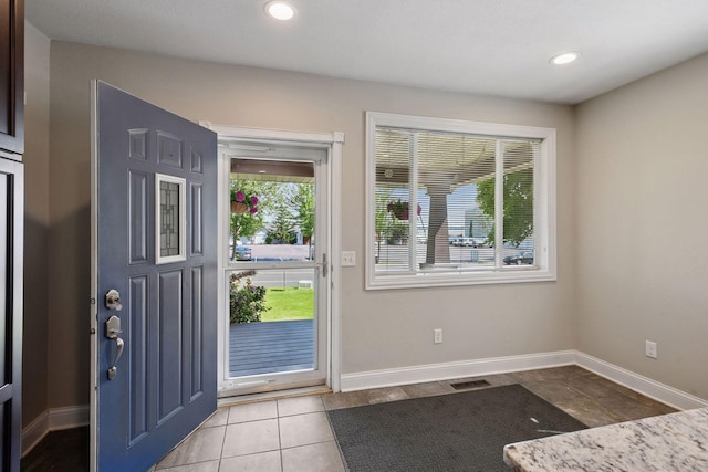301 Lake St, Waconia, MN 55387 - entryway with baseboards, recessed lighting, and light tile patterned flooring