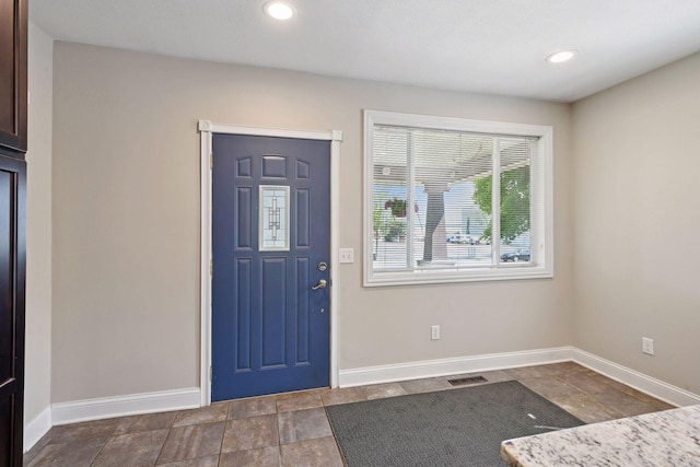 301 Lake St, Waconia, MN 55387 - entrance foyer featuring baseboards, stone finish flooring, and recessed lighting