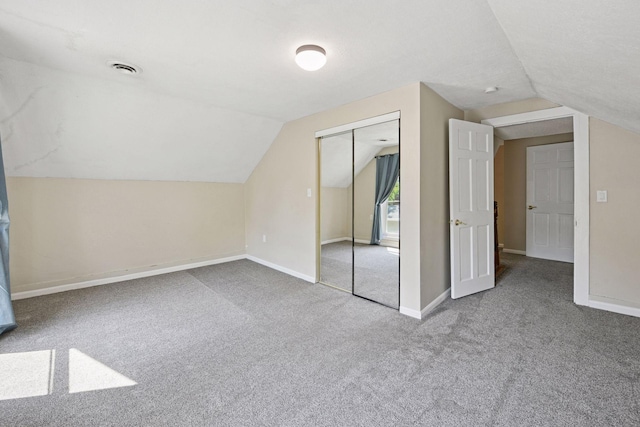 301 Lake St, Waconia, MN 55387 - additional living space featuring vaulted ceiling, carpet, and baseboards
