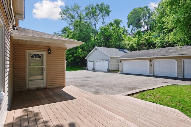301 Lake St, Waconia, MN 55387 - wooden terrace with an outdoor structure and a detached garage
