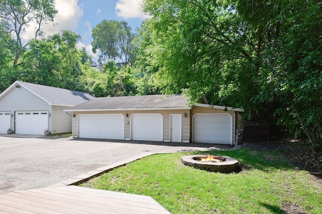 301 Lake St, Waconia, MN 55387 - view of front of property with a fire pit, an outbuilding, and a front yard