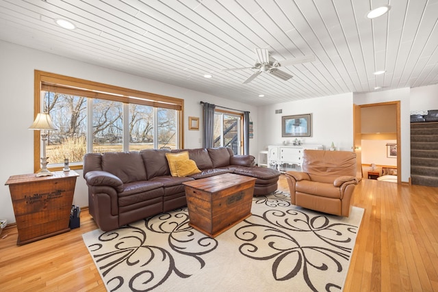 living room with wood ceiling, ceiling fan, hardwood / wood-style floors, stairs, and recessed lighting