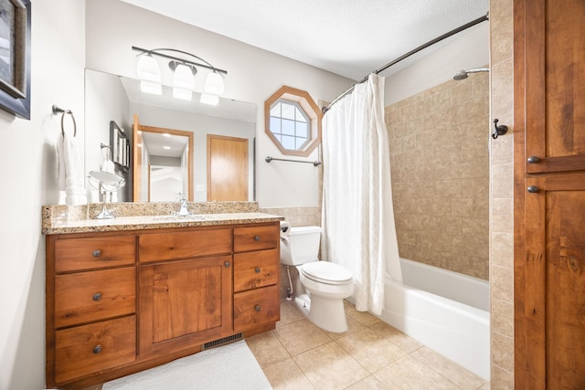 bathroom featuring shower / tub combo, visible vents, toilet, tile patterned flooring, and vanity