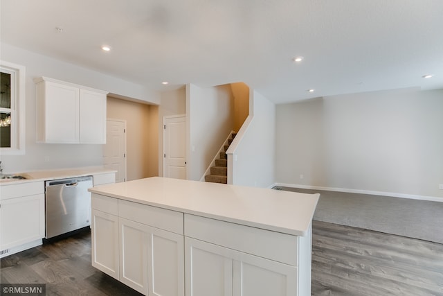 kitchen featuring dishwasher, dark wood-style flooring, white cabinetry, and recessed lighting