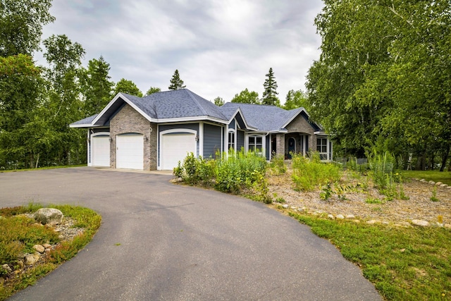 35365 Boot Lake Rd, Park Rapids, MN 56470 - ranch-style home with driveway, brick siding, and an attached garage