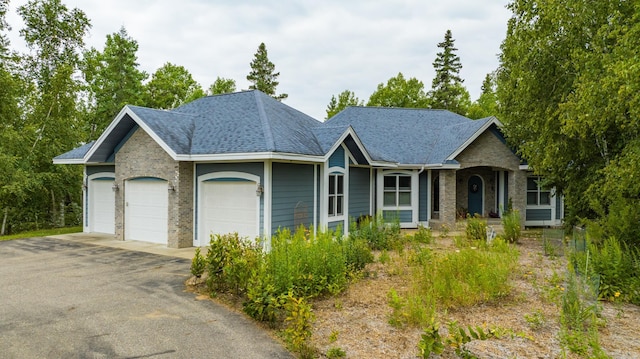 35365 Boot Lake Rd, Park Rapids, MN 56470 - single story home featuring a garage, driveway, a shingled roof, and brick siding