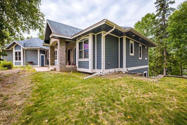35365 Boot Lake Rd, Park Rapids, MN 56470 - exterior space with brick siding and a lawn