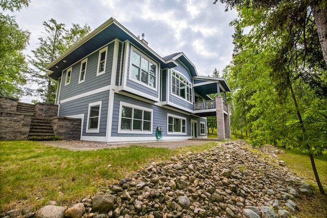 35365 Boot Lake Rd, Park Rapids, MN 56470 - back of property featuring a lawn, stairway, and a balcony
