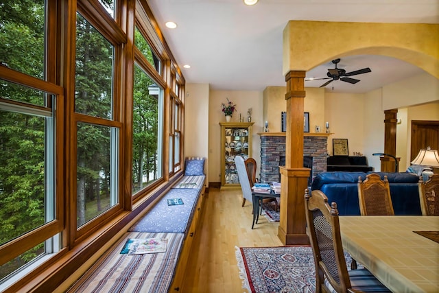 35365 Boot Lake Rd, Park Rapids, MN 56470 - dining space featuring a wealth of natural light, light wood-type flooring, and a fireplace