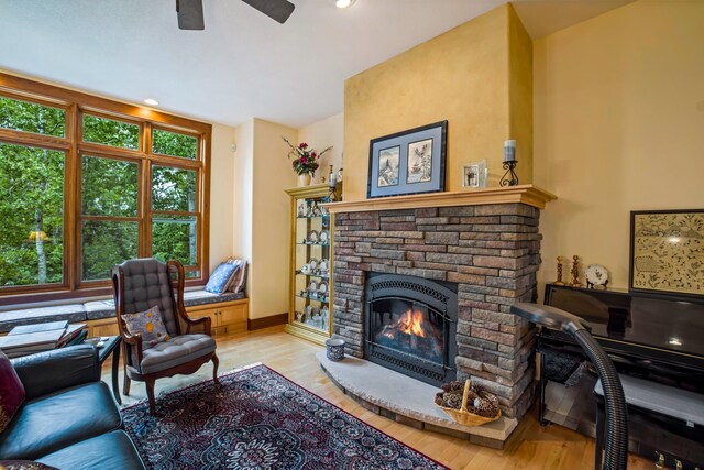 35365 Boot Lake Rd, Park Rapids, MN 56470 - living area with recessed lighting, a fireplace, wood finished floors, a ceiling fan, and baseboards