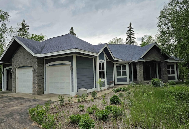 35365 Boot Lake Rd, Park Rapids, MN 56470 - ranch-style house featuring brick siding, driveway, and an attached garage