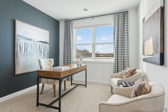 home office featuring baseboards and light colored carpet