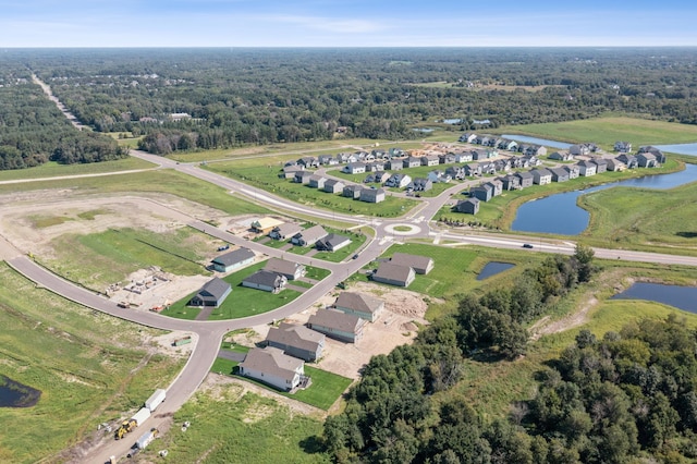 birds eye view of property featuring a water view and a residential view