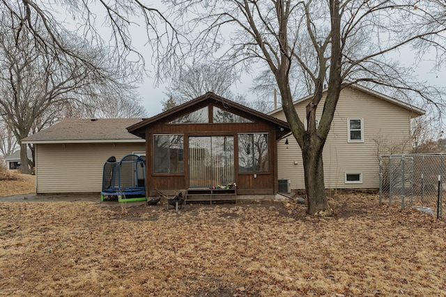 back of property with a trampoline and cooling unit