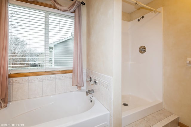 full bathroom featuring a wealth of natural light, a bath, and walk in shower