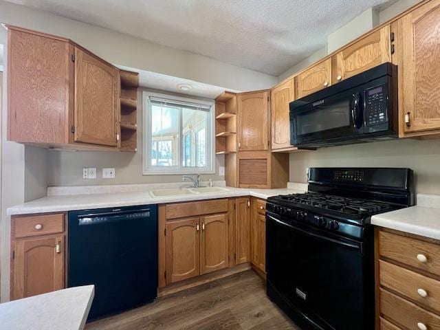 kitchen with dark wood-style flooring, open shelves, a sink, a textured ceiling, and black appliances