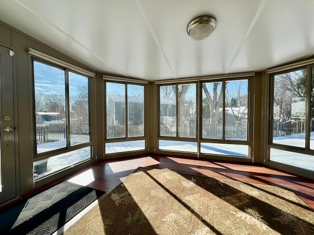 unfurnished sunroom with a wealth of natural light